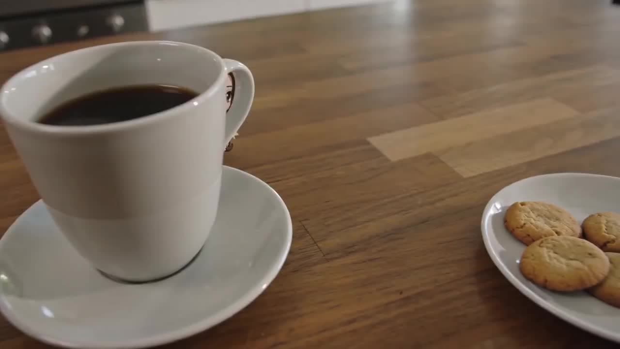 Steaming Coffee and Cookies on Wood Table